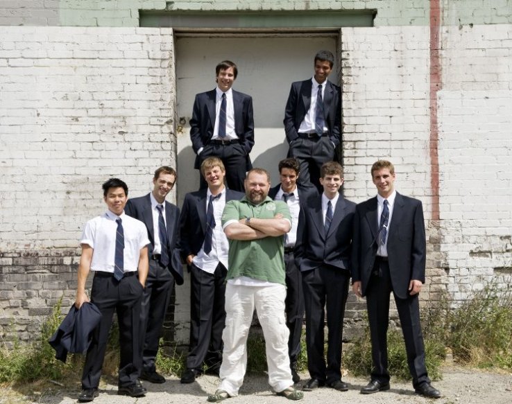 Director Dean Paul Gibson and the younger portion of the cast of The History Boys. Photo by David Cooper